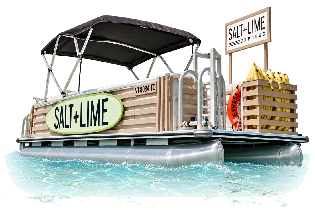 The Salt + Lime Express, a pontoon boat with a black canopy, a Salt + Lime sign and a crate of bananas, on the water